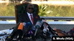 FILE - Former Zimbabwean President Robert Mugabe addresses journalists at his residence in Harare, July 29, 2018.