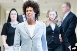 Andrea Constand walks to the courtroom during Bill Cosby's sexual assault trial at the Montgomery County Courthouse in Norristown, Pa., June 6, 2017.