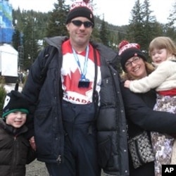 Spectator and ticket holder John Walkinshaw and family after men's snowboard cross event at Cypress Mountain, 15 Feb. 2010