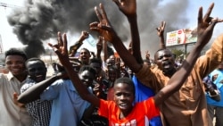 Sudanese people protest against a military coup that overthrew the transition to civilian rule, on October 25, 2021 in the capital Khartoum's twin city of Omdurman