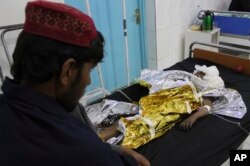 An injured boy receives treatment at a hospital after an airstrike in Helmand province, southern Afghanistan, Nov. 28, 2018. Civilians and Taliban fighters were killed in the strike as Afghan government forces battled insurgents.