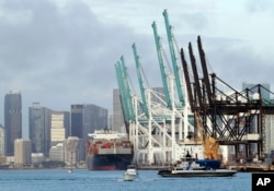 A container ship is docked at the Port of Miami, Monday, Feb. 5, 2018, in Miami Beach, Fla. The Commerce Department reports on the U.S. trade gap for December, on Feb. 6.