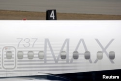 FILE - A Boeing 737 MAX 8 aircraft is parked at a Boeing production facility in Renton, Washington, March 11, 2019.