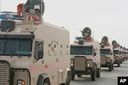 Saudi Arabian troops cross the causeway leading to Bahrain in this still image taken from video, March 14, 2011