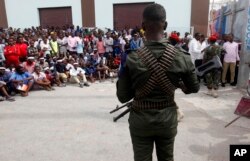 An armed soldier stand guard at Zobe junction during the anniversary an explosion in the capital of Mogadishu, Somalia, Oct. 14, 2018.