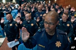 Over 300 officers from other jurisdictions, including many from the California Highway Patrol, are sworn in to have police powers in Cleveland, as preparations continue for the Republican National Convention in Cleveland, Ohio, July 16, 2016.