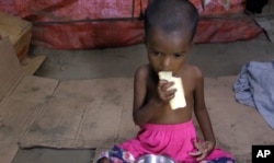 Rosmaida has trouble eating all of ready-to-eat packets of therapeutic food paste.