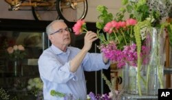 Rick McVey, owner of Dilly Lily, works at his shop in Chicago, April 26, 2017.