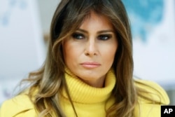 FILE - First lady Melania Trump listens as she meets with personnel at Cincinnati Children's Hospital Medical Center, in Cincinnati, Feb. 5, 2018.