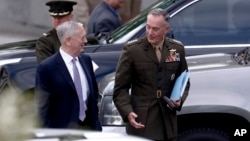 Defense Secretary Jim Mattis and Joint Chiefs Chairman Gen. Joseph Dunford talks as they walk from an all Senators briefing on the situation in the Koreas, April 26, 2017, at the Eisenhower Executive Office Building on the White House complex in Washington.