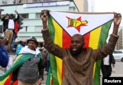 Protesters gather calling for Zimbabwean President Robert Mugabe to step down, in Harare, Zimbabwe, Nov. 18, 2017.