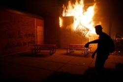 People set a fire during continued protest May 29, 2020, in Minneapolis.