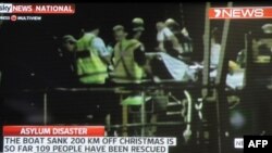 Screen grab shows asylum-seeker survivors arriving at Christmas Island after their boat capsized 120 nautical miles north of Christmas Island, 2,600 kilometres (1,600 miles) from the Australian mainland, June 22, 2012.