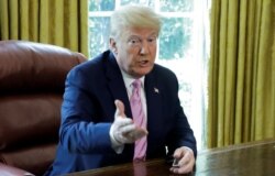 U.S. President Donald Trump speaks during a Good Friday event for Easter in the Oval Office at the White House in Washington, April 10, 2020.
