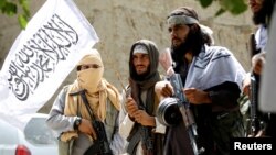 Taliban celebrate ceasefire in Ghanikhel district of Nangarhar province, Afghanistan, June 16, 2018.