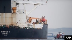 A ship approaches supertanker Grace 1 off the coast of Gibraltar on July 6, 2019. 