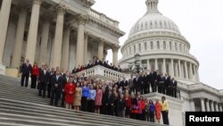 Snow is plowed behind a jogger running on the Washington Monument grounds in Washington. Snow fell in parts of the Mid-Atlantic and Northeast as winter-weary motorists faced another potentially treacherous commute, just days before the start of spring.