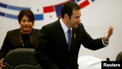 FILE - Guatemala's President Jimmy Morales gestures during a meeting of the Central American Integration System (SICA), in Guatemala City, Guatemala, June 5, 2019.