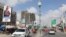 Motorists drive past the campaign billboard of Somalia's opposition presidential candidate Abdirahman Abdishakur Warsameh along the main streets of Mogadishu, Somalia, Feb. 8, 2021.
