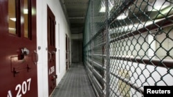 FILE - The interior of an unoccupied communal cell block is seen at Camp VI, a prison used to house detainees at the U.S. Naval Base at Guantanamo Bay on March 5, 2013. 