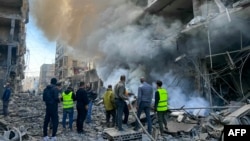 Firefighters douse a blaze at the site of an Israeli airstrike in the Ghobeiry neighborhood of Beirut's southern suburbs on Nov. 15, 2024, amid the ongoing war between Israel and Hezbollah.