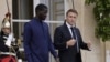 FILE - Senegalese President Bassirou Diomaye Faye and French President Emmanuel Macron leave the Elysee Palace after a lunch in Paris on June 20, 2024. Senegal is one of several African nations that have asked France to withdraw its troops from their territory.