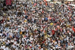 Demonstrators rally to protest against the military coup in Yangon, Myanmar, Feb. 22, 2021.