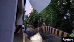 A balloon believed to have been sent by North Korea, carrying various objects including what appeared to be trash, is pictured in Incheon, South Korea, June 2, 2024.