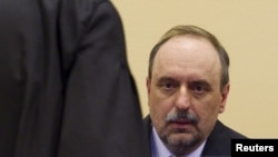 Goran Hadzic, the last of Serbia's alleged war criminals, makes his initial appearance to stand trial on crimes against humanity at the International Criminal Tribunal for the former Yugoslavia (ICTY) in the Hague July 25, 2011.