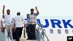 Turkish truck drivers captured earlier by militants in northern Iraq at an airport in Irbil, Iraq, July 3, 2014.