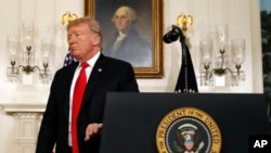 President Donald Trump leaves the podium after speaking about the partial government shutdown, immigration and border security in the Diplomatic Reception Room of the White House in Washington, Jan. 19, 2019. 