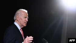 In this file photo taken on March 12, 2020 former US Vice President and Democratic presidential hopeful Joe Biden speaks during a press event in Wilmington, Delaware.