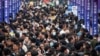 FILE - People attend a job fair in China's southwestern city of Chongqing on April 11, 2023.