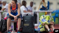 FILE - Russia's Maria Kuchina, left, prepares to compete in the Russian Athletics Cup, at Zhukovsky, outside Moscow, Russia, July 21, 2016. Kuchina is among 10 Russians the IAAF has so far approved this year to compete as neutrals.