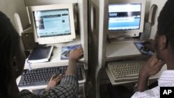 FILE - Nigerians browse the internet at a cybercafe in Lagos, Nigeria. 