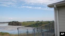 This former nursing home - which was purchased by FirstEnergy Corporation for the company’s proposed expansion project - overlooks the Little Blue Run waste ash dump. The chemicals give it a blue tint.