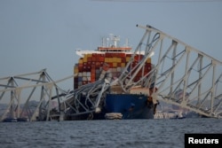 A view of the Dali cargo vessel which crashed into the Francis Scott Key Bridge causing it to collapse in Baltimore, Maryland, U.S., March 26, 2024. (REUTERS/Julia Nikhinson)