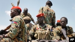 FILE - A group of South Sudanese government soldiers sit on the back of a pickup truck in Malakal, South Sudan, Oct. 16, 2016.