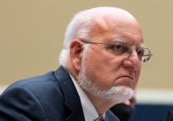 FILE - Dr. Robert Redfield, Director of the Centers for Disease Control and Prevention, testifies on Capitol Hill, June 23, 2020.