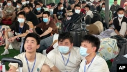 Chinese believed to have been trafficked and trapped into working in online scam centers after they were rescued in Myawaddy district in eastern Myanmar, Feb. 17, 2025.