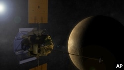An artist's concept shows the MESSENGER spacecraft in orbit around Mercury.