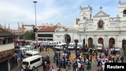 Sri Lankan military officials stand guard in front of the St. Anthony's Shrine, Kochchikade church after an explosion in Colombo, Sri Lanka, April 21, 2019.