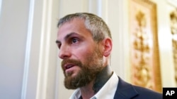 Michael Fanone, a Washington Metropolitan Police Department officer who was attacked and beaten during the Jan. 6, attack on the Capitol, leaves a meeting with House Minority Leader Kevin McCarthy, R-Calif., at the Capitol in Washington, June 25, 2021.