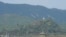 FILE - A North Korean loudspeaker, top left, a military guard post, top right, and a South Korean military guard post, bottom, are seen from Paju, South Korea, near the border with North Korea, Oct. 10, 2024. 