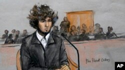FILE - A courtroom sketch depicts Boston Marathon bombing suspect Dzhokhar Tsarnaev sitting in federal court in Boston, Massachusetts, Dec. 18, 2014.