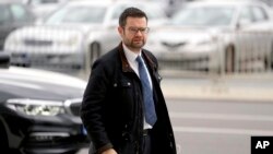 Marco Buschmann, parliamentary undersecretary of the German Liberals (FDP) arrives for coalition negotiations with representatives of the German Green party (Die Gruenen) and the German Social Democratic party (SPD) in Berlin, Germany, Oct. 21, 2021.