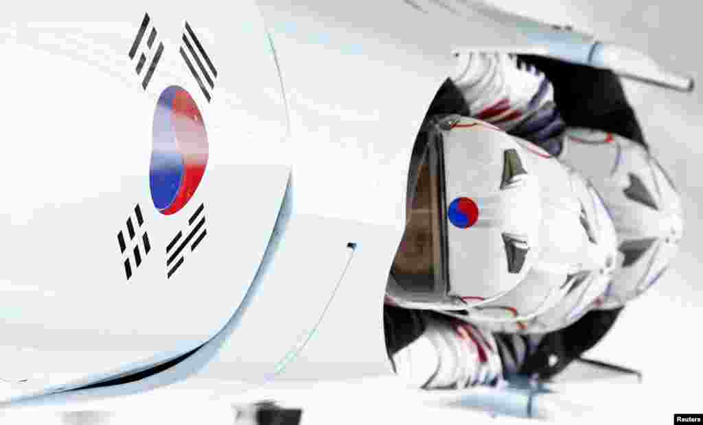 South Korea's pilot Kim Dong-hyun (front) and his teammates speed down the track during a four-man bobsleigh training session at the Sanki Sliding Center in Rosa Khutor, near Sochi, Feb. 20, 2014.&nbsp;