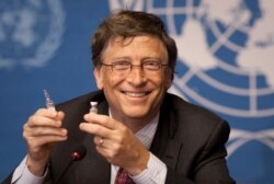 FILE - Microsoft founder Bill Gates holds a vaccine for meningitis during a news conference at U.N. headquarters in Geneva, Switzerland, May 17, 2011.