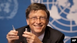 FILE - In this May 17, 2011 file photo, Microsoft founder Bill Gates holds a vaccine for meningitis during a news conference at the United Nations headquarters in Geneva, Switzerland.