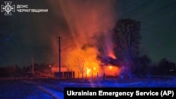Buildings burn after a Russian drone attack in Chernihiv region, Ukraine, Dec. 13, 2024.